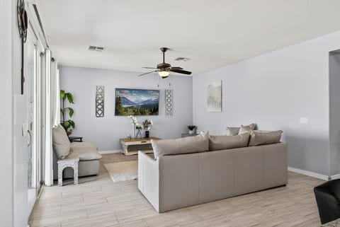 Bright, airy living room with a spacious sectional and natural light
