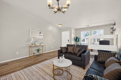 Bright, stylish living room with cozy seating and family-friendly bunk beds