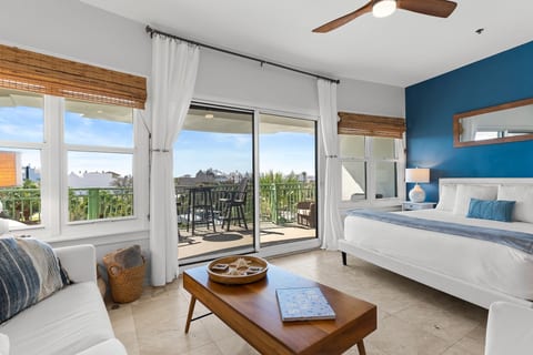 Bright coastal studio with king bed and private furnished balcony
