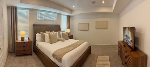 Master room with smart tv and walking closet.