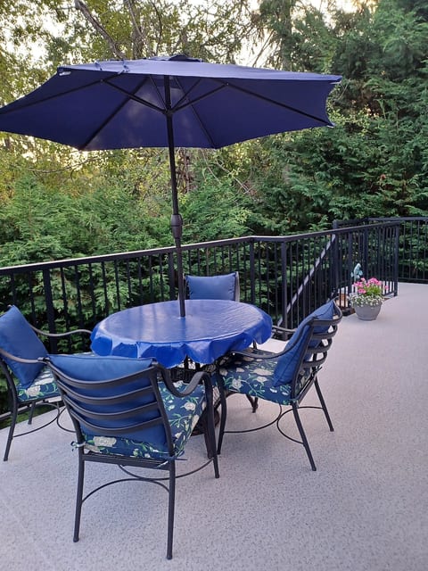 Patio table and chairs with umbrella