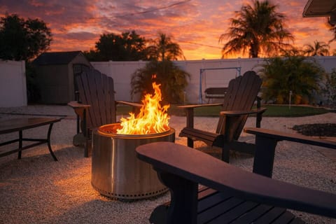 Relax by the fire pit and enjoy sunset views in this private backyard