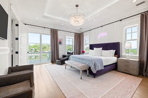 Spacious king suite, balcony with lake view and ambient lighting, day or night