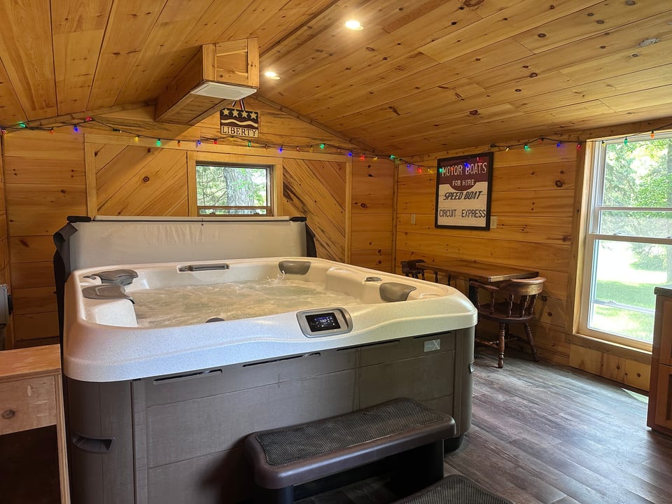 Hot tub in the red out building behind the home that can be enjoyed in all seasons!