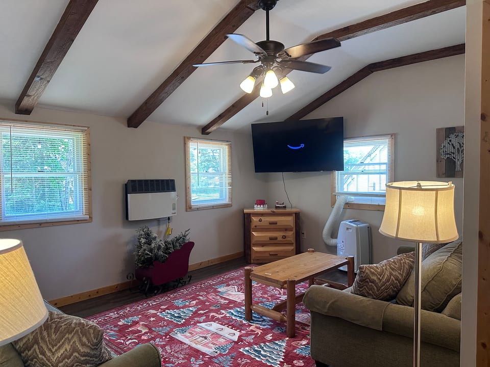 Living Room with 2 couches and Roku TV with Amazon Prime subscription
