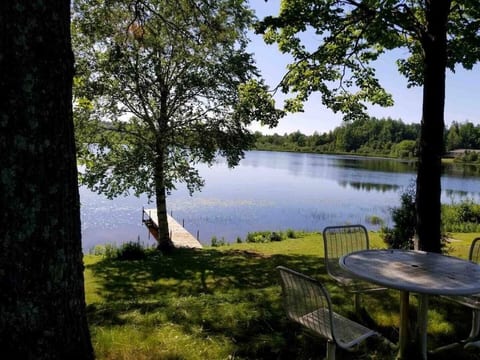 Stunning lake views from the back porch, perfect for morning coffee or evening sunsets! Private dock, 2 kayaks & 12' rowboat included with rental