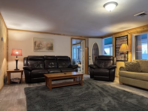 Recently remodeled living room with tongue and groove pine and new flooring that is more pet friendly.