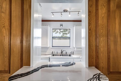 Take a rest at the bar while you chat with the chef and you both enjoy another fabulous lake view!