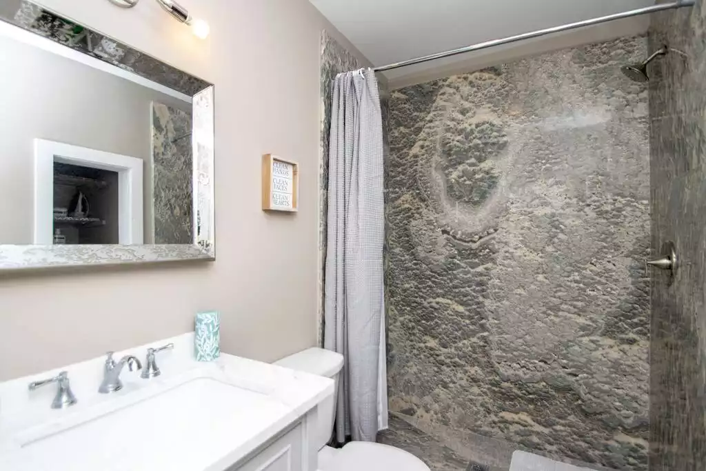 Your newly remodeled bathroom is stocked with soft luxurious towels, shampoo, soap and hair dryer. - White Water Cottage - Little Rock