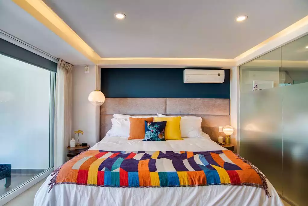 The master suite features a king sized bed with Sealy Posturepedic mattress.