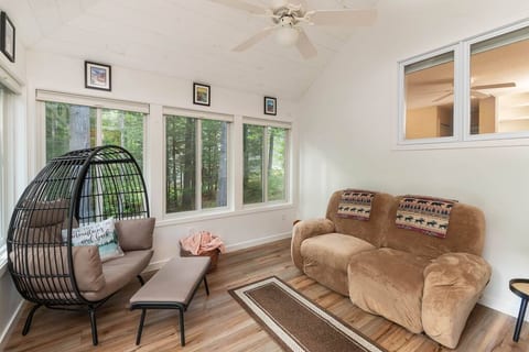 Cozy up in the sunroom and enjoy beautiful views of White Mountain National Forest