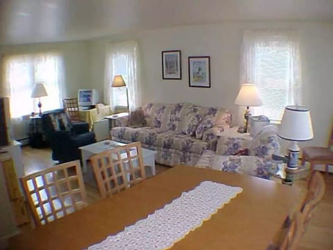 Cheerful, cozy, comfortable living/dining room is sunlit all day long - sunrise to sunset - and features original art and photography by local artists.