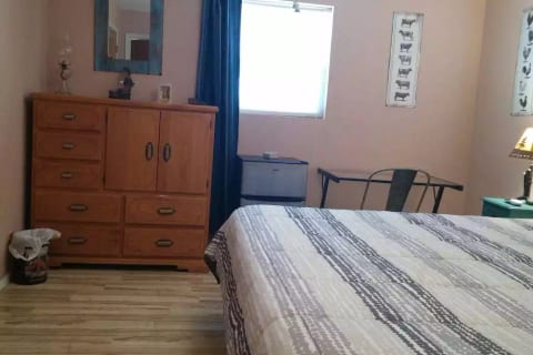 Dresser, mini-refrigerator/freezer, desk with chair.