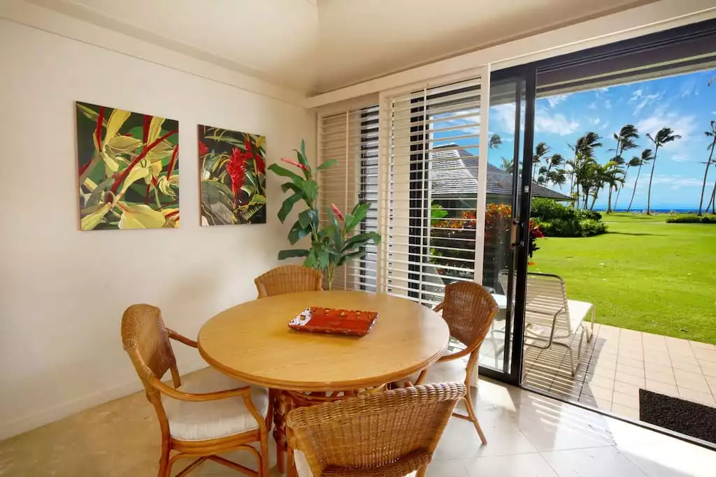 Marvel at the ocean view while eating at the dining table. - KAUAI | OCEANVIEW | POIPU BEACH IS YOUR BACKYARD - Koloa