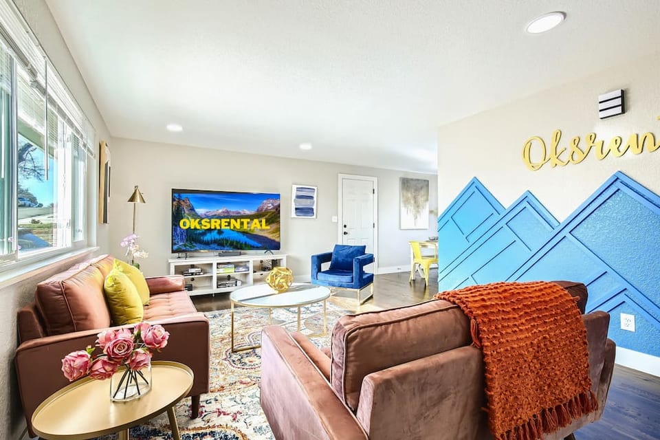 upper level living room with 75in TV.