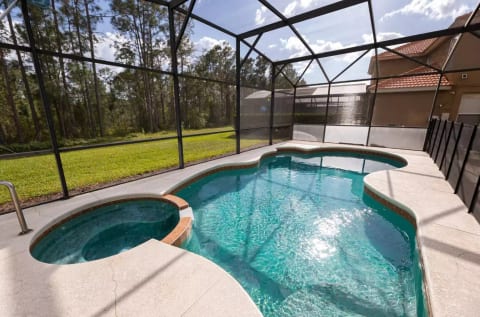 Lanai with outdoor dining area, and south-facing pool deck