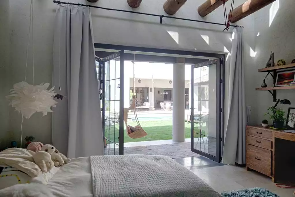 2nd bedroom with 2 twin beds (also can be made into king), looking out to pool and hanging swing - CASA DEL TORO - POOL, GREAT VIEWS, GREAT LOCATION - San Miguel de Allende