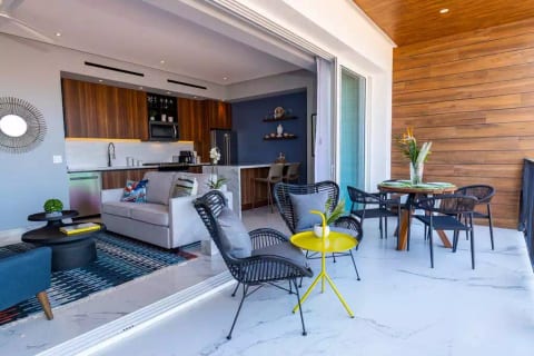 Huge sliding glass doors open up to the large, private balcony with comfortable seating and a Dining Table for 4. There are views of the city and peek-a-boo views of the ocean just a few blocks away.