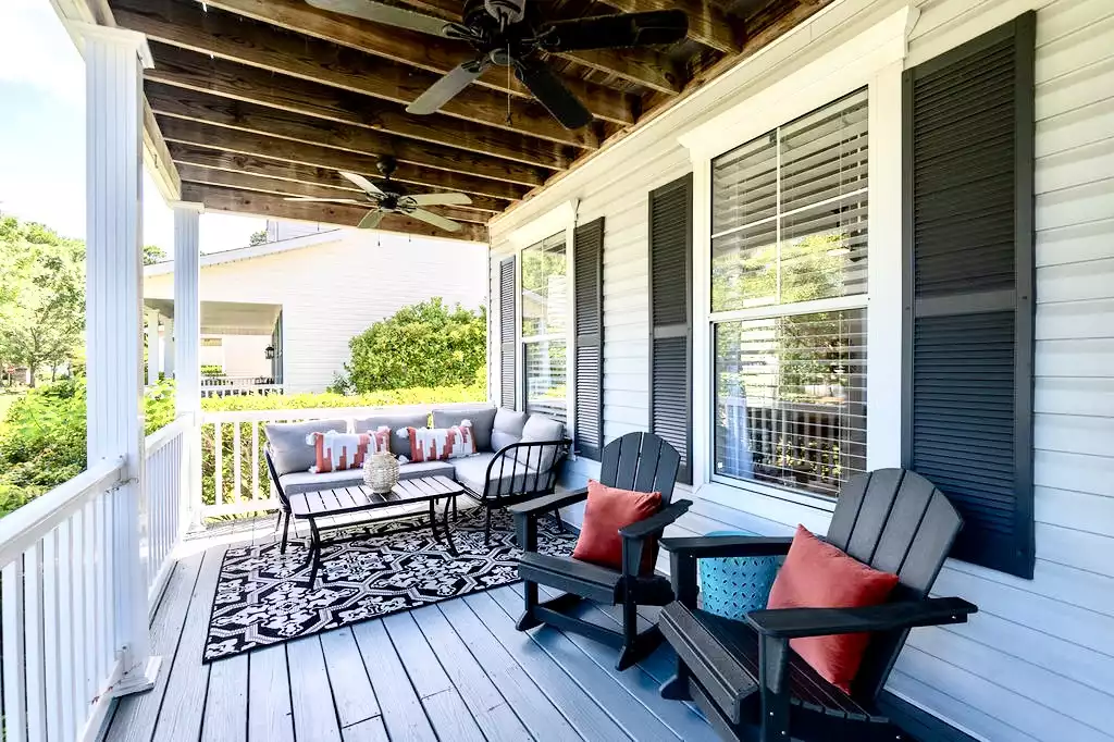Plenty of room to relax on the front porch - one of 3 large outdoor and covered spaces at The Coral Door!