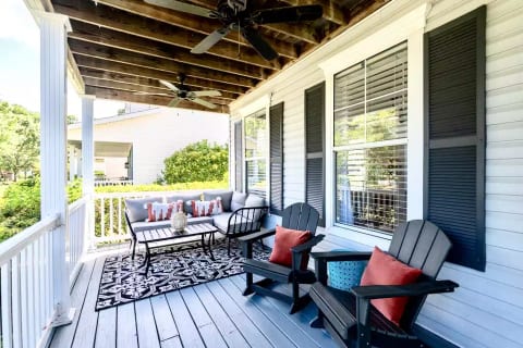 Plenty of room to relax on the front porch - one of 3 large outdoor and covered spaces at The Coral Door!
