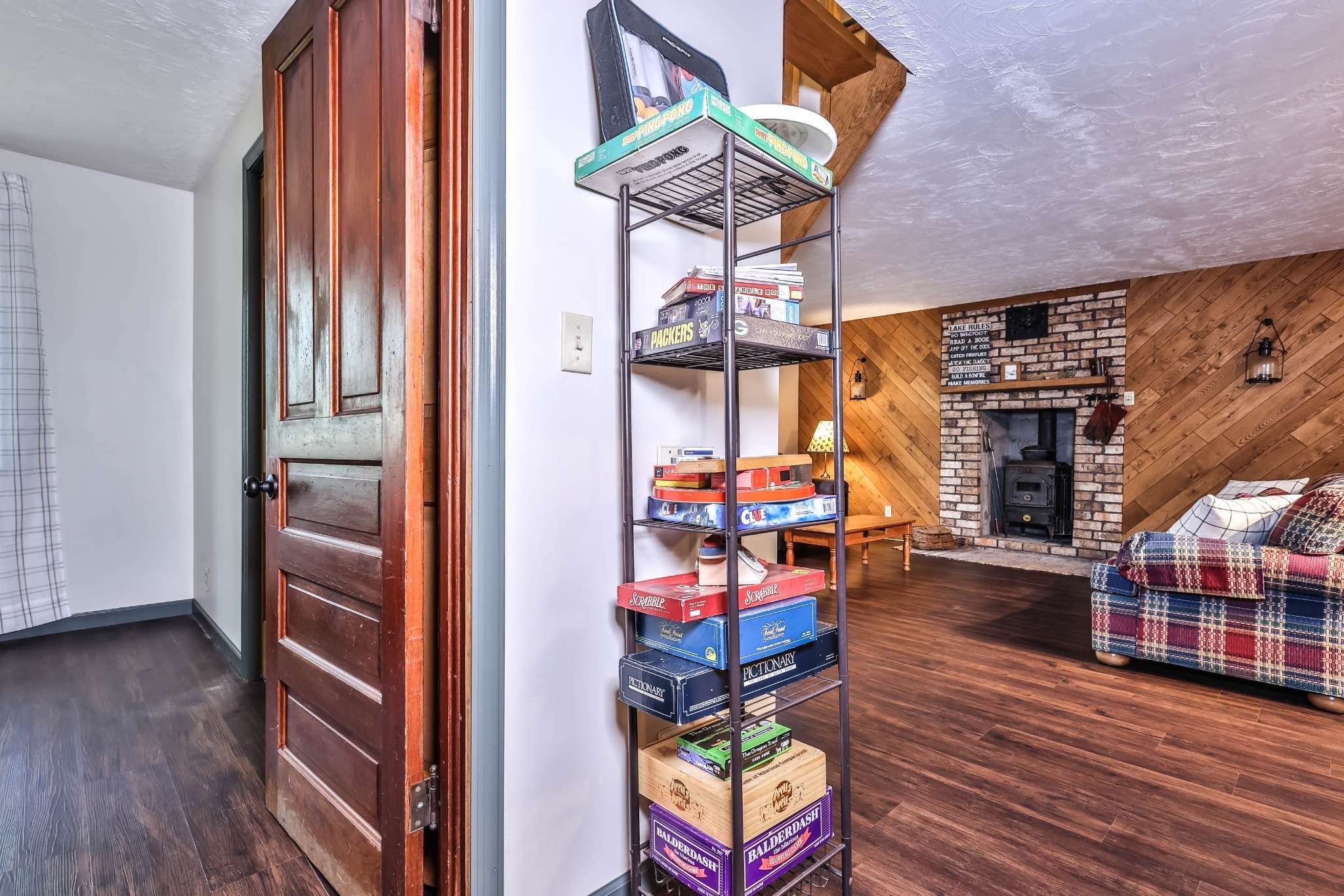 Tons of board games in the hallway. - Family & Dog Friendly Private Year Round Lakefront - Arbor Vitae