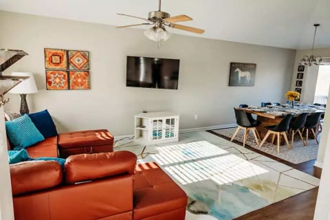 When you walk in the door, you are in the first of two living areas, which includes living room, dining room and kitchen with vaulted ceilings and tasteful modern decor.