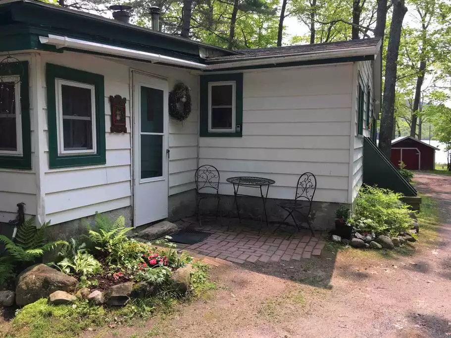 Entryway into the mud room where you'll find a washer and dryer. - Camp Pocomoonshine - Cozy/Lake Access/Hot Tub - Keeseville