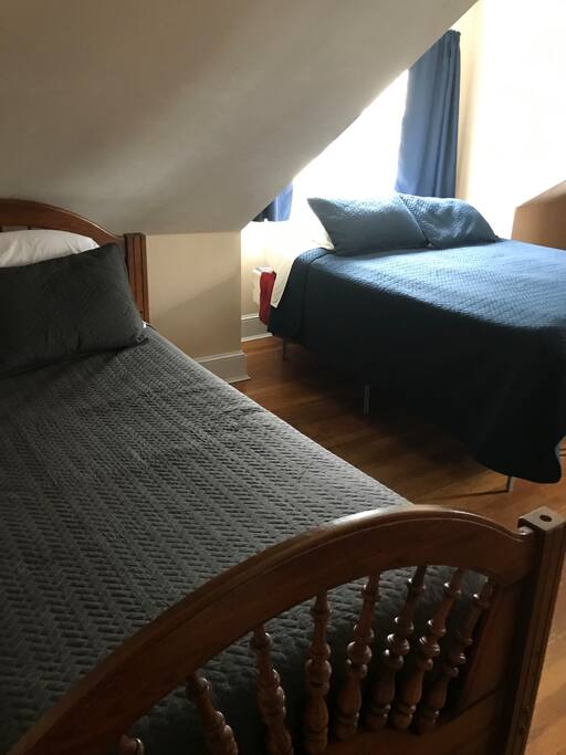 Largest of the upstairs bedrooms has a queen bed and 2 twin beds . Bedroom also has large bureau and closet - Warm & Sunny All Year Round. Come Visit!  - Fairhaven