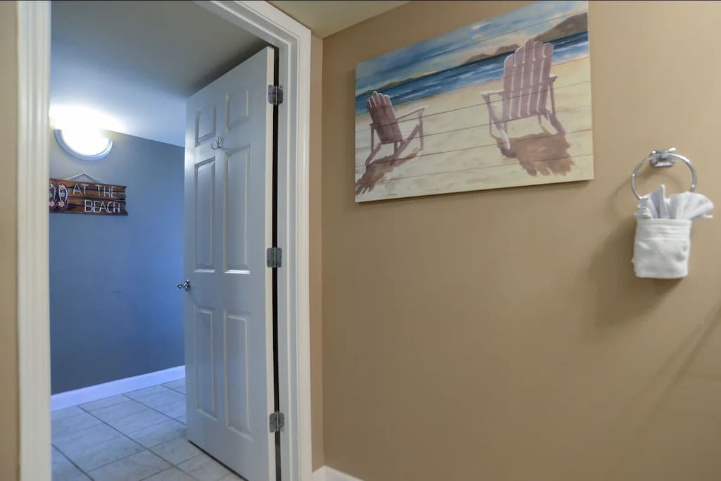 Bathroom Decor and Beach Sign in the Hallway