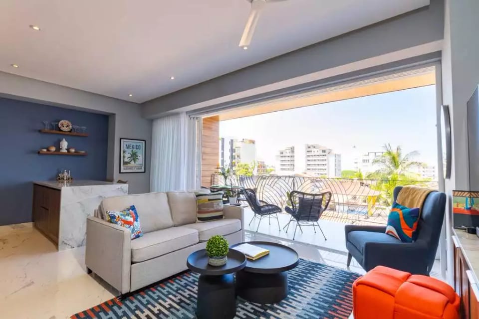 Beautifully furnished open concept space with wide glass doors opening up to the large Balcony.