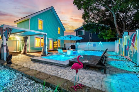 Come home when the pool's lit up and the sky's still pink at the edges — the view that makes the whole day worth it.
