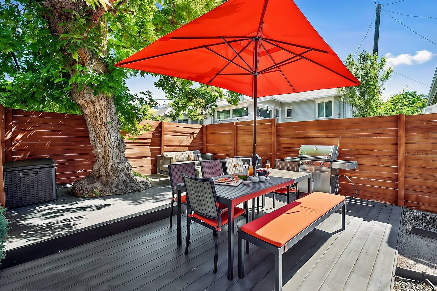 The outdoor dining area seats up to 8 with additional seating around the firepit. Cook up your favorite meals on the Genesis BBQ Grill and relax under the elder tree. Romantic lights automatically flicker on in the evenings.