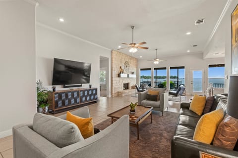 Relax in the spacious family and living rooms with plush seating, breathtaking lake views, and an 85” Smart TV loaded with Netflix, YouTubeTV, Paramount+, Peacock, and more—all backed by ultra-fast internet.