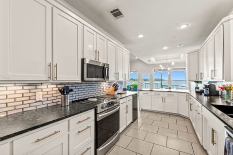 Fully remodeled modern kitchen featuring ample counter space—perfect for preparing meals with ease and style.