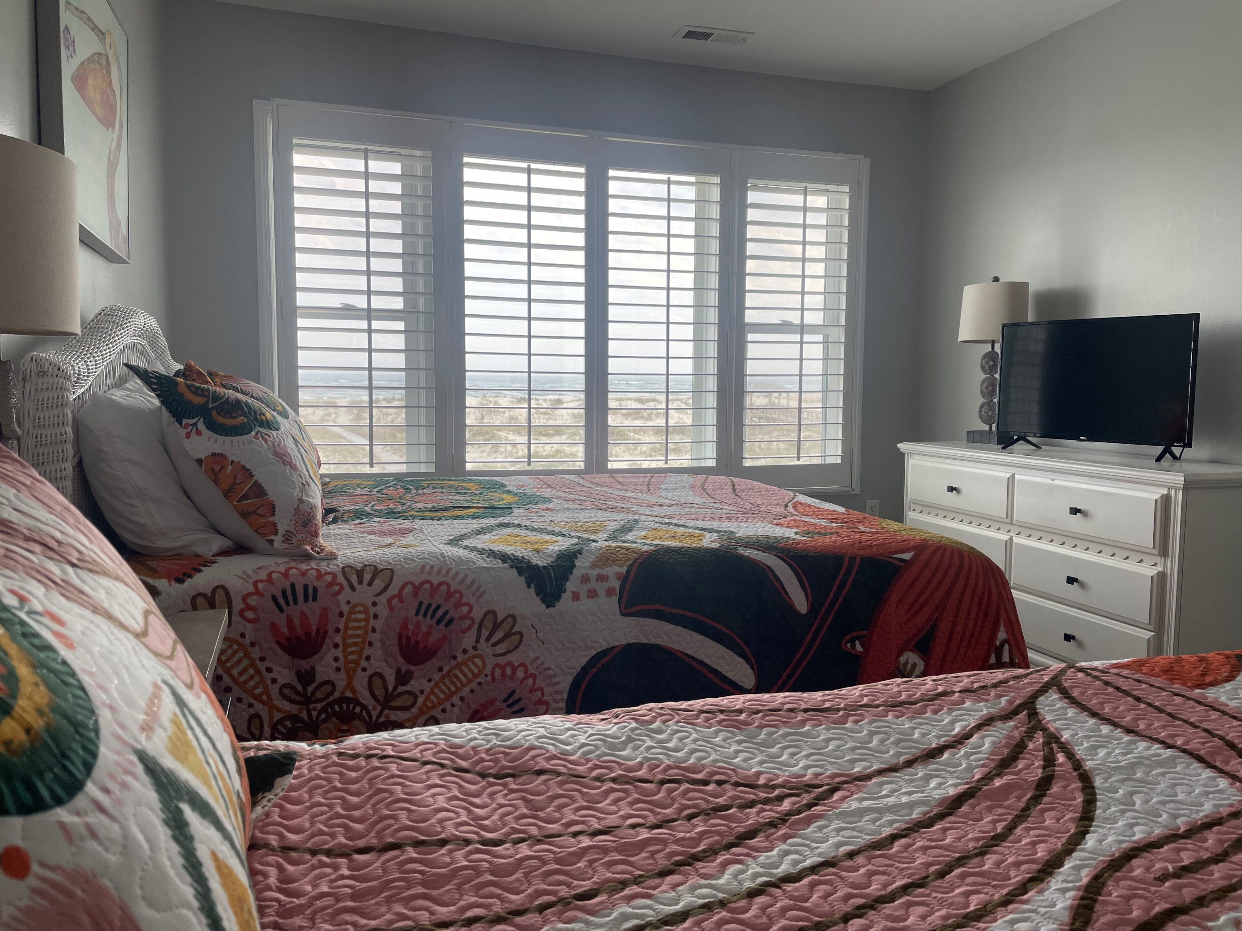 Large oceanfront bedroom with queen and twin beds West
