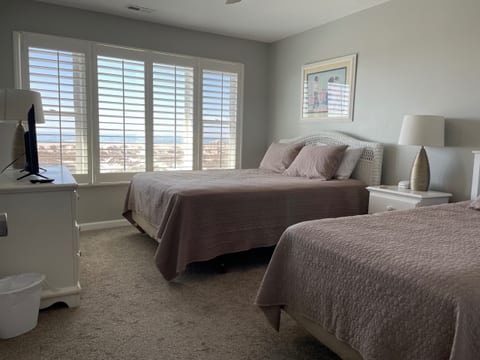 Oceanfront bedroom with queen and twin beds