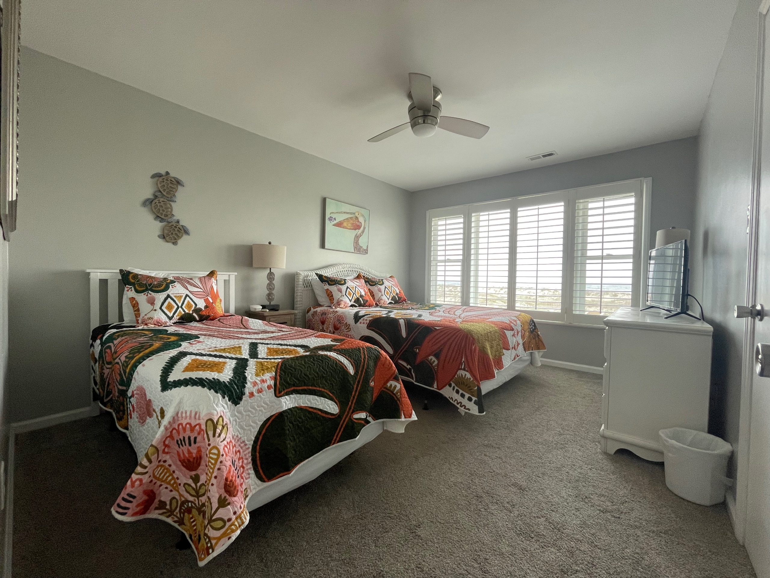 Large oceanfront bedroom with queen and twin beds West