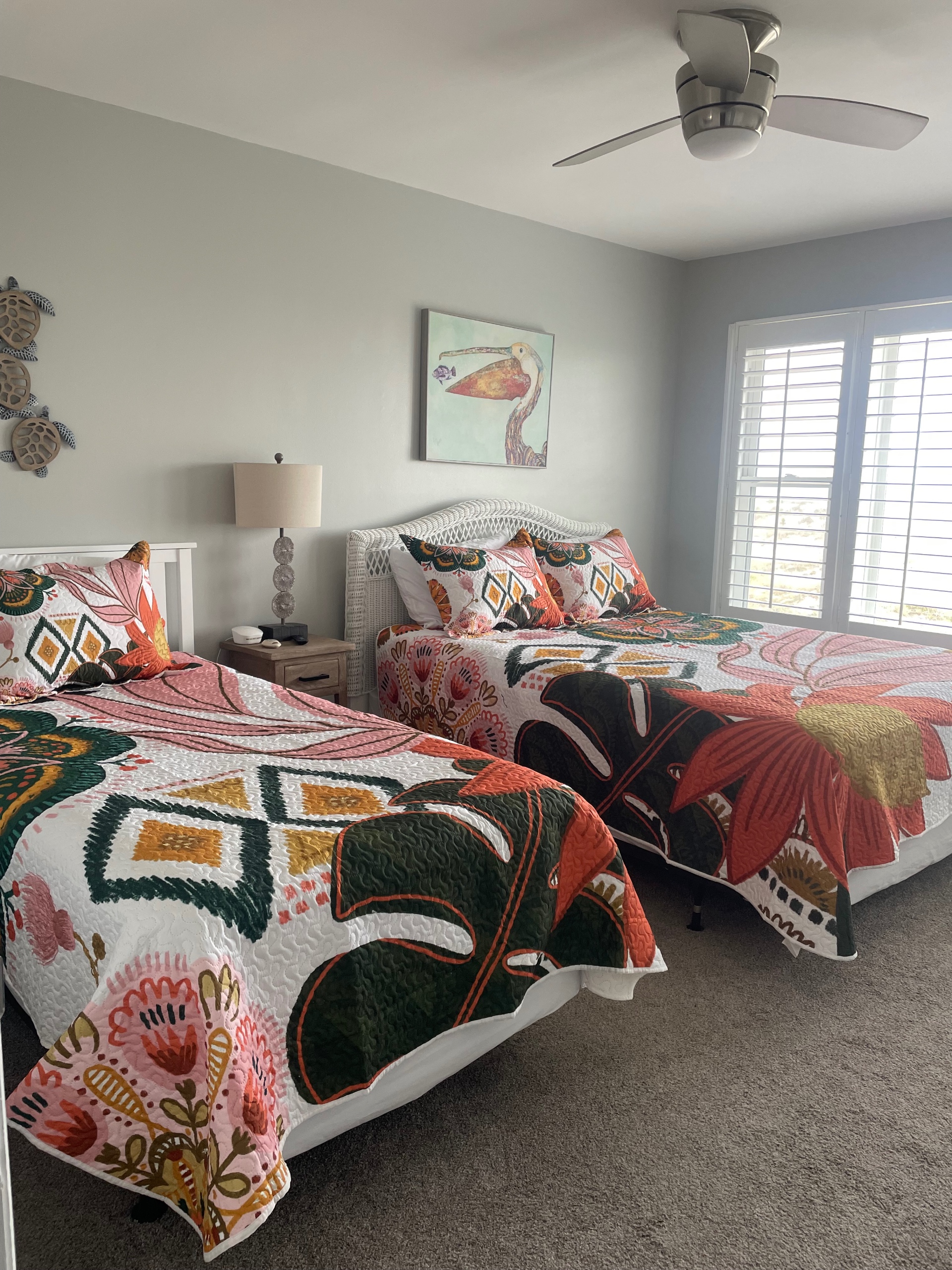Large oceanfront bedroom with queen and twin beds West