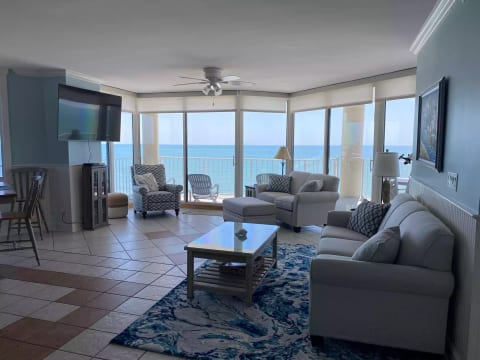 Beautifully Decorated Family Room with Stunning Wall of Windows!