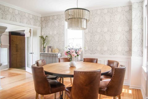 Savor a meal with 8 people around the dining table, while enjoying each other's company, basking in this 130 year old dining room, with original wood floors, beautiful millwork and stunning wallpaper.