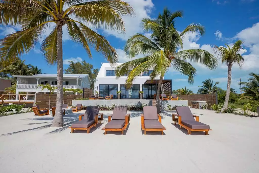 Picture yourself lounging in the sun here on these comfy chairs! Picture yourself lounging in the sun here on these comfy chairs! - Spectacular beachfront home with pool, gym, more! - San Pedro