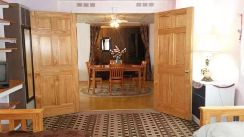 View to the dining and living room area from bedroom 1