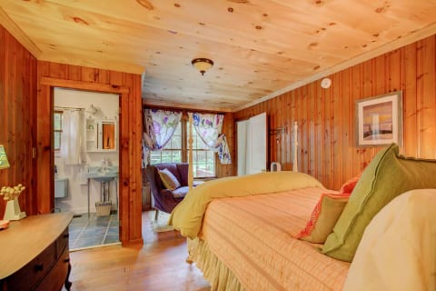 Queen Bedroom with private bathroom. Overlooks backlawn and woods.