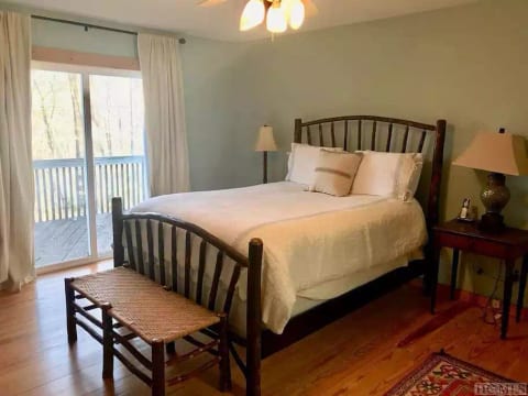 Master Bedroom on main floor w/Queen bed and private bath, opens onto deck