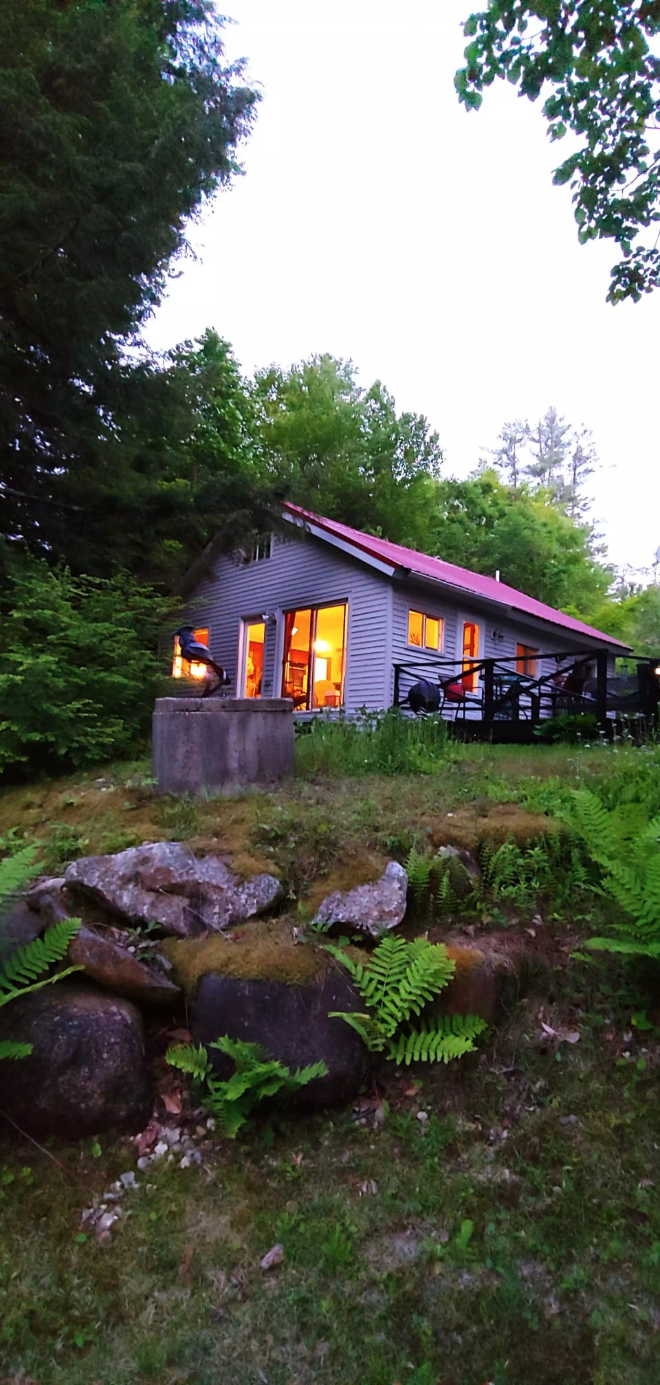 Twilight at the cottage looking up from the river.
