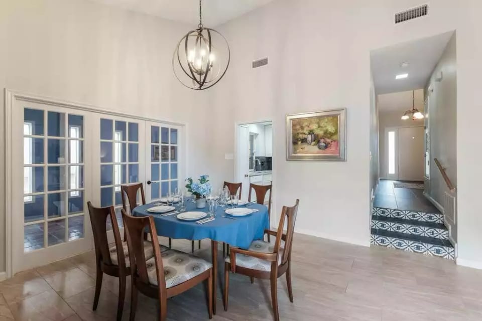 Dining room open to living room. French doors to Florida Room and Patio.