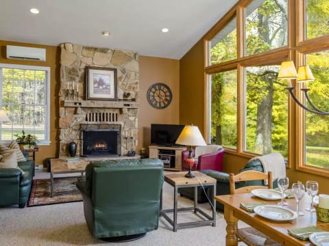 Spacious great room, comfortable seating & magnificent views out wall of windows