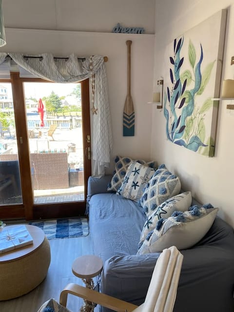 Comfortable full size sleeper couch looks right out to the water.