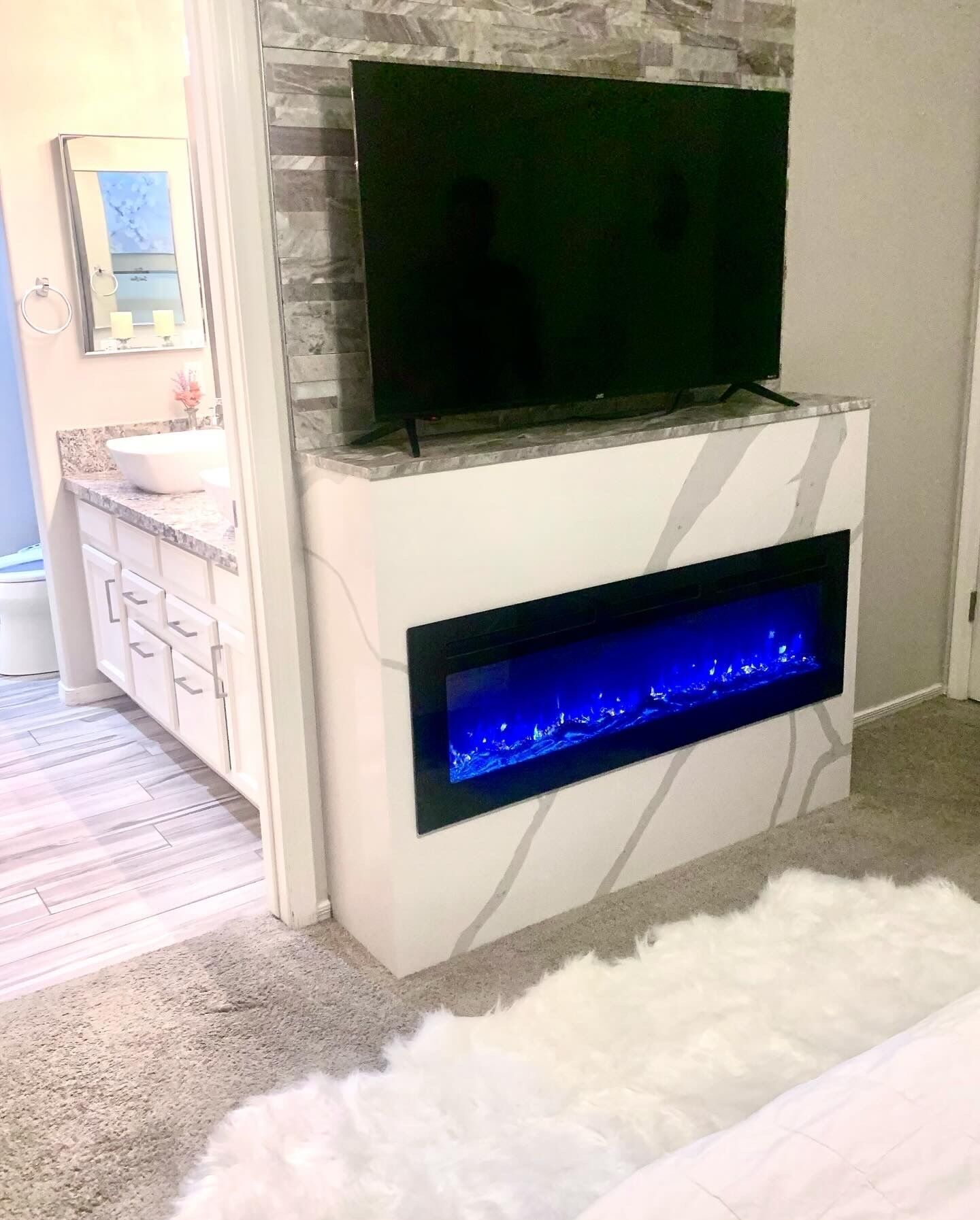 Master Bed electric fireplace for ambient lighting & additional heat in winter