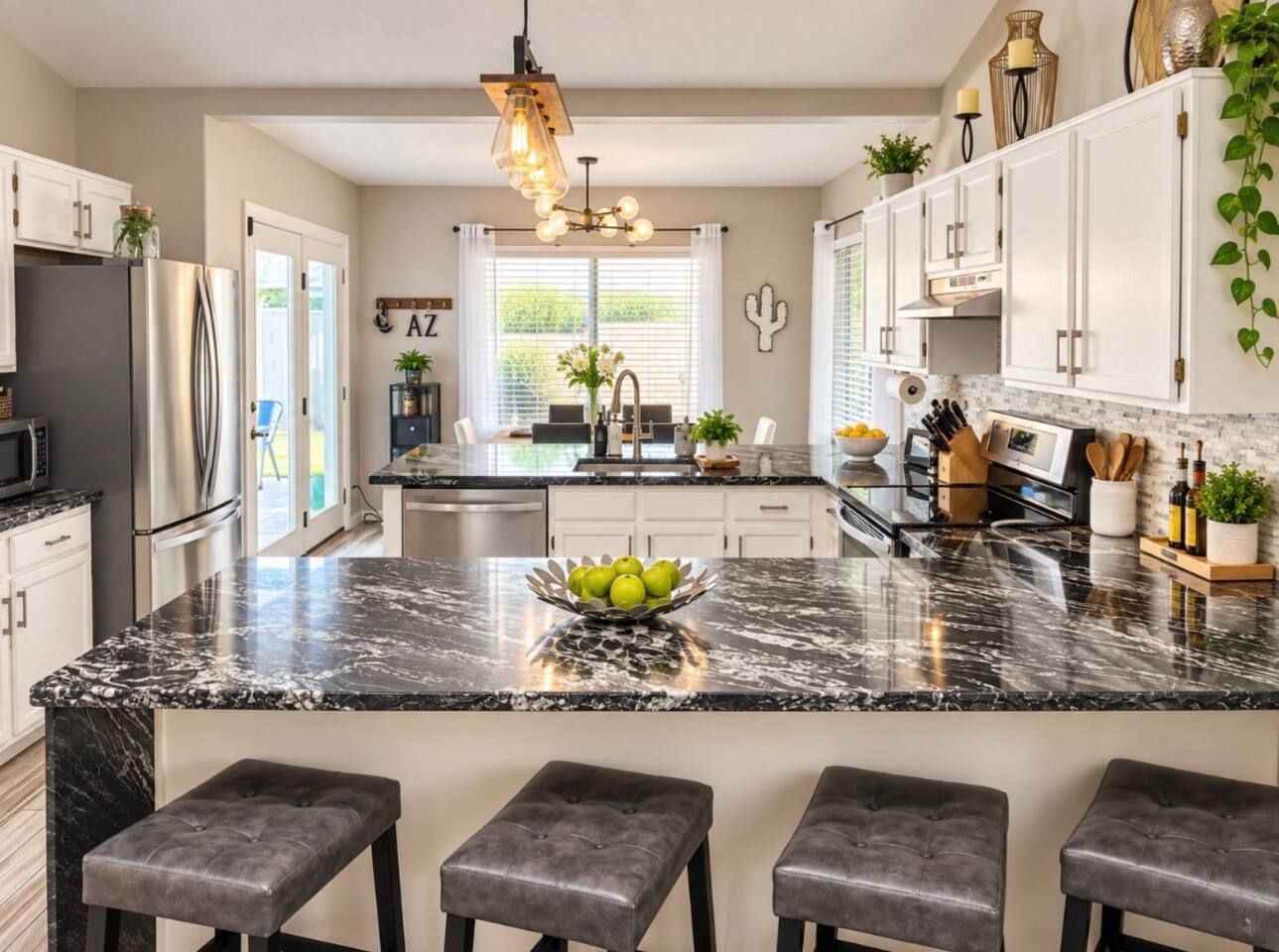 Fully stocked remodeled stylish kitchen with granite counter tops brass accents and new light fixtures and breakfast bar. Kenmore Elite Double oven, full size refrigerator, ice maker, dishwasher & garbage disposal. Stadium Oasis Glendale, Az